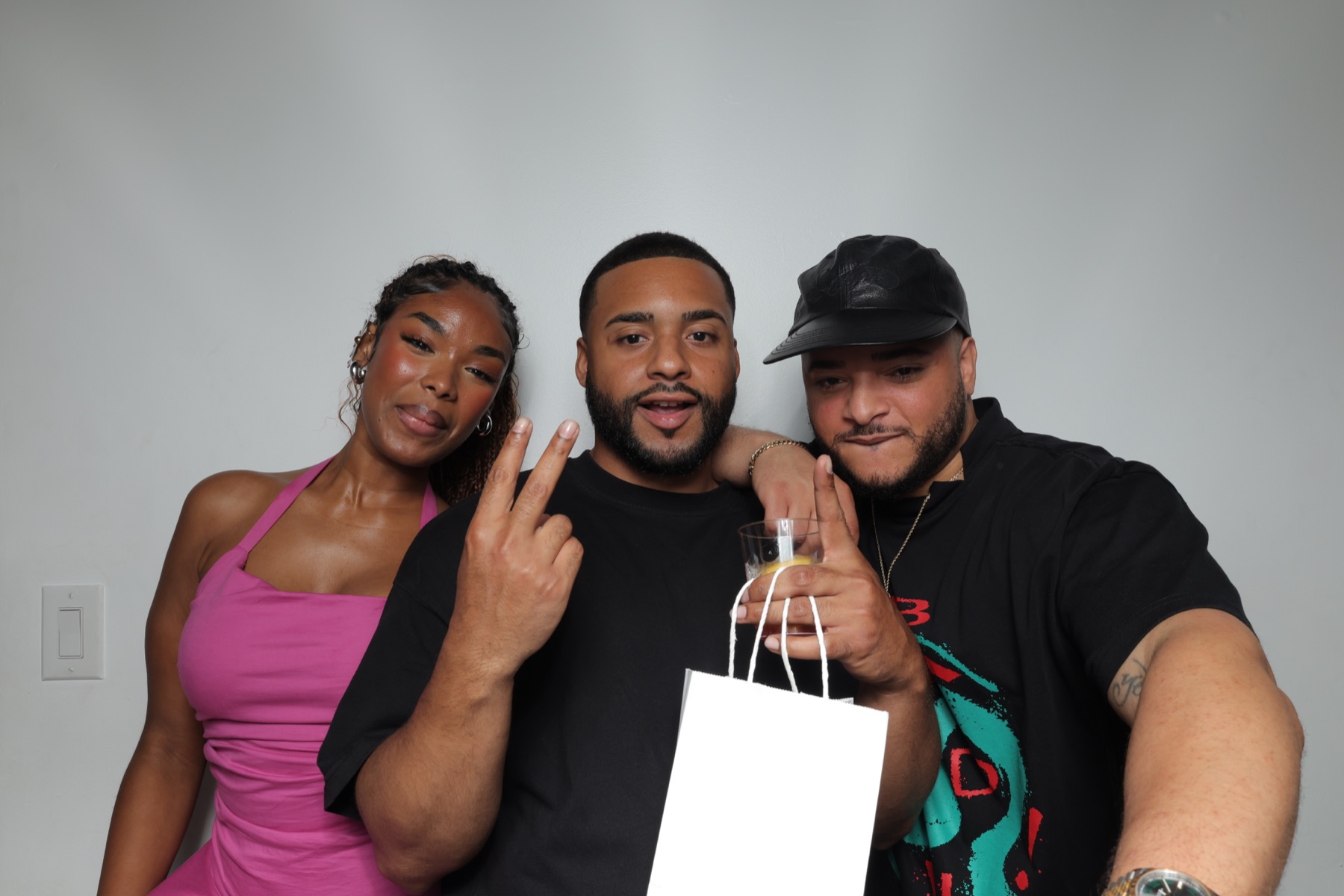 Guests smiling in a photobooth group photo