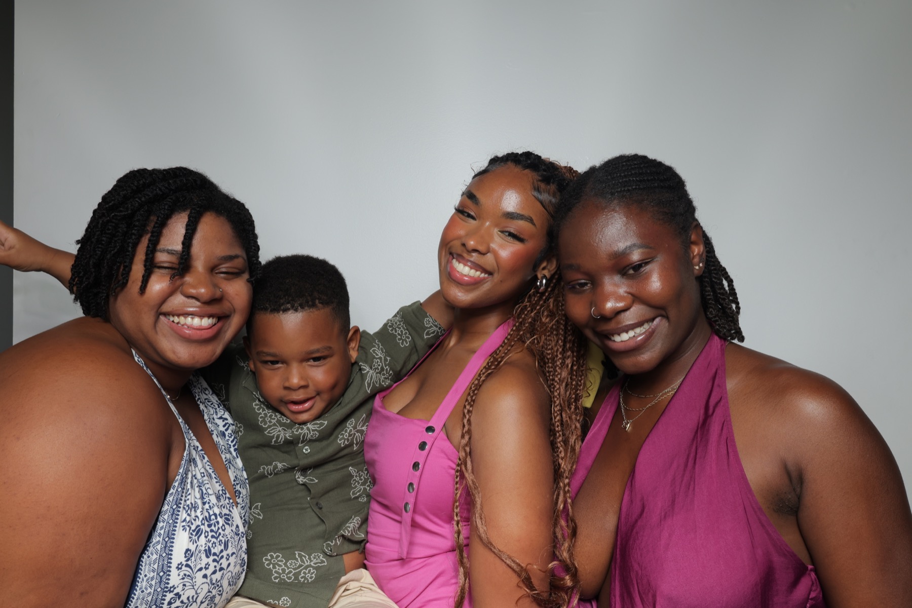 Friends making fun faces in a photobooth print